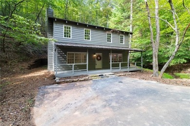 Welcome to charming *Creekside Cabin* tucked away in the on Big Canoe Golf Club - Cherokee in Georgia - for sale on GolfHomes.com, golf home, golf lot