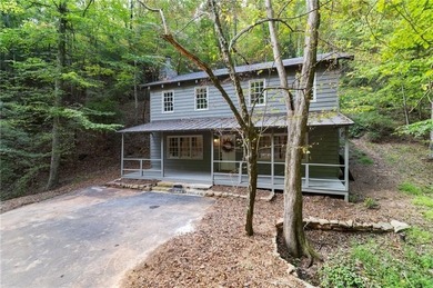 Welcome to charming *Creekside Cabin* tucked away in the on Big Canoe Golf Club - Cherokee in Georgia - for sale on GolfHomes.com, golf home, golf lot