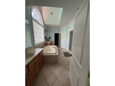 This beautiful brick home is nestled along the 14th hole of on Indian Trace Golf Course in Georgia - for sale on GolfHomes.com, golf home, golf lot