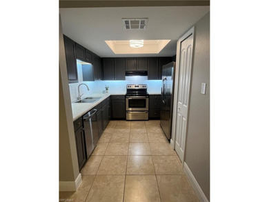 Beautifully Renovated FIRST FLOOR, CORNER UNIT with private on Fountain Lakes Community Golf Course in Florida - for sale on GolfHomes.com, golf home, golf lot