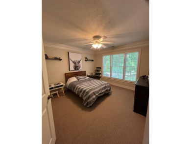 This beautiful brick home is nestled along the 14th hole of on Indian Trace Golf Course in Georgia - for sale on GolfHomes.com, golf home, golf lot