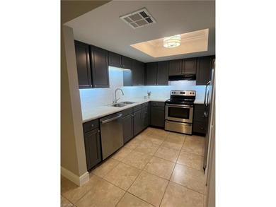 Beautifully Renovated FIRST FLOOR, CORNER UNIT with private on Fountain Lakes Community Golf Course in Florida - for sale on GolfHomes.com, golf home, golf lot