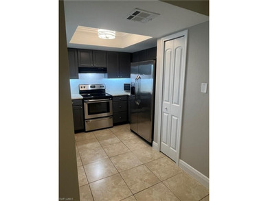 Beautifully Renovated FIRST FLOOR, CORNER UNIT with private on Fountain Lakes Community Golf Course in Florida - for sale on GolfHomes.com, golf home, golf lot