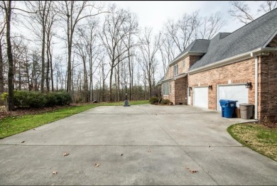 This beautiful brick home is nestled along the 14th hole of on Indian Trace Golf Course in Georgia - for sale on GolfHomes.com, golf home, golf lot