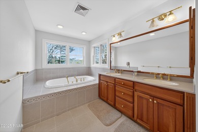 Welcome to this immaculate 4-bedroom LAKEFRONT home in the on Lords Valley Country Club, Inc in Pennsylvania - for sale on GolfHomes.com, golf home, golf lot