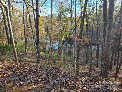 Here's your chance to own a lakefront lot along Shumont Lake on Rumbling Bald Resort on Lake Lure in North Carolina - for sale on GolfHomes.com, golf home, golf lot