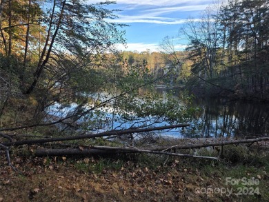 Here's your chance to own a lakefront lot along Shumont Lake on Rumbling Bald Resort on Lake Lure in North Carolina - for sale on GolfHomes.com, golf home, golf lot