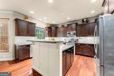Welcome home to this stunning 5-bedroom, 3.5-bathroom gem on Traditions of Braselton Golf Club in Georgia - for sale on GolfHomes.com, golf home, golf lot