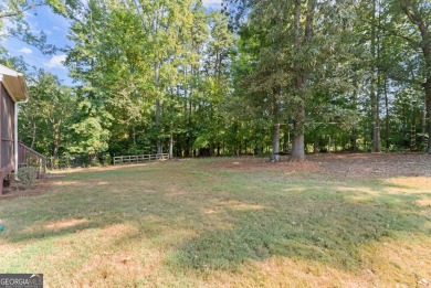 Welcome home to this stunning 5-bedroom, 3.5-bathroom gem on Traditions of Braselton Golf Club in Georgia - for sale on GolfHomes.com, golf home, golf lot