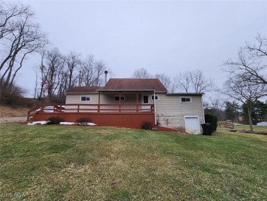 Well-maintained 3-bedroom, 1-bath home with eat-in kitchen and on Cadiz Country Club in Ohio - for sale on GolfHomes.com, golf home, golf lot