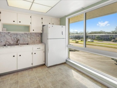 WOW! HERE IS AN AWESOME COZY 2ND FLOOR CONDOMINIUM LOCATED IN on The Glades Golf and Country Club in Florida - for sale on GolfHomes.com, golf home, golf lot