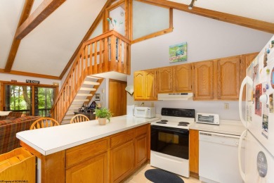 Welcome to 'Putter's Paradise', a delightful cabin nestled in on Alpine Lake Resort in West Virginia - for sale on GolfHomes.com, golf home, golf lot