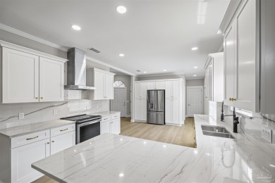 Beautifully updated home on the 13th tee of Tiger Point Golf on Tiger Point Golf and Country Club in Florida - for sale on GolfHomes.com, golf home, golf lot