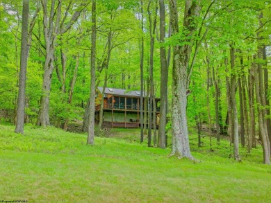 Welcome to 'Putter's Paradise', a delightful cabin nestled in on Alpine Lake Resort in West Virginia - for sale on GolfHomes.com, golf home, golf lot