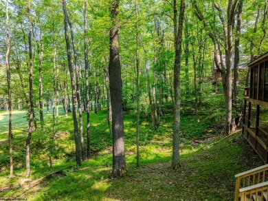 Welcome to 'Putter's Paradise', a delightful cabin nestled in on Alpine Lake Resort in West Virginia - for sale on GolfHomes.com, golf home, golf lot