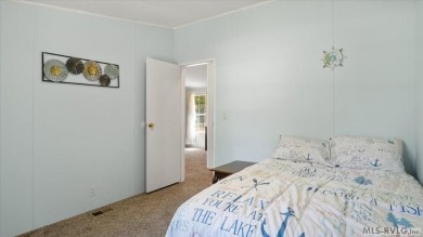 Fully furnished and move-in ready! This beautifully remodeled on Tanglewood Shores Golf Club in Virginia - for sale on GolfHomes.com, golf home, golf lot