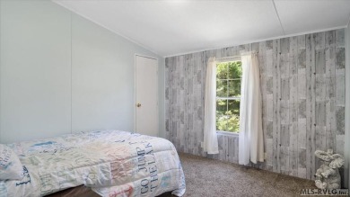 Fully furnished and move-in ready! This beautifully remodeled on Tanglewood Shores Golf Club in Virginia - for sale on GolfHomes.com, golf home, golf lot