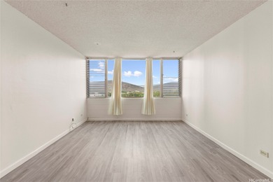 Come home to tranquil golf course views in this 2-bedroom on Honolulu Country Club in Hawaii - for sale on GolfHomes.com, golf home, golf lot