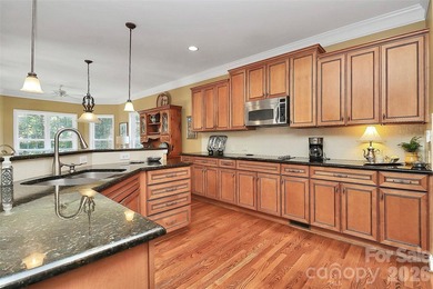 Discover refined living in this elegant full brick home on 3rd on The Palisades Country Club in North Carolina - for sale on GolfHomes.com, golf home, golf lot