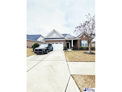 Welcome to 309 Dormie Lane, a luxury residence located behind on The Members Club At Woodcreek in South Carolina - for sale on GolfHomes.com, golf home, golf lot