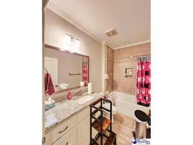 Welcome to 309 Dormie Lane, a luxury residence located behind on The Members Club At Woodcreek in South Carolina - for sale on GolfHomes.com, golf home, golf lot