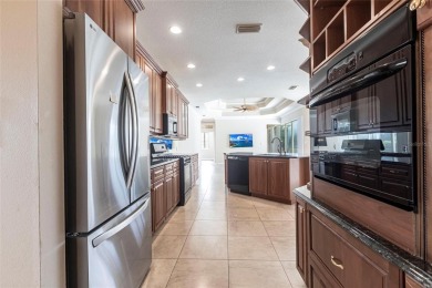 Welcome to 7211 Treymore Ct., an elegant and meticulously on Palm Aire Country Club of Sarasota in Florida - for sale on GolfHomes.com, golf home, golf lot