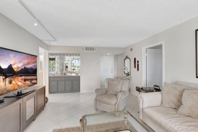 BRIDGEWOOD  2 BED 2 BATH CORNER UNIT. THE VILLAGE OF BRIDGEWOOD on Boca West Golf and Country Club in Florida - for sale on GolfHomes.com, golf home, golf lot