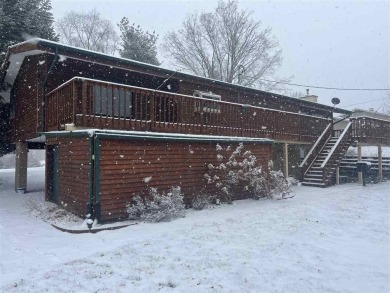 Cozy up to the crackle of the real wood fireplace in this home on Lake McBride Golf Course in Iowa - for sale on GolfHomes.com, golf home, golf lot