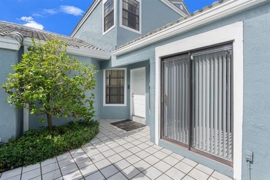 Great buy! Just reduced! Spacious, bright corner-unit townhome on Woodmont Country Club in Florida - for sale on GolfHomes.com, golf home, golf lot