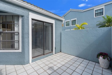 Great buy! Just reduced! Spacious, bright corner-unit townhome on Woodmont Country Club in Florida - for sale on GolfHomes.com, golf home, golf lot