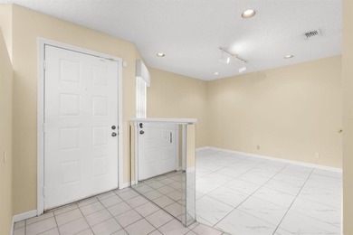 Great buy! Just reduced! Spacious, bright corner-unit townhome on Woodmont Country Club in Florida - for sale on GolfHomes.com, golf home, golf lot
