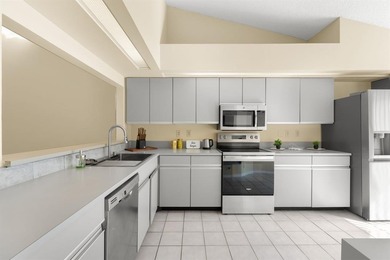 Great buy! Just reduced! Spacious, bright corner-unit townhome on Woodmont Country Club in Florida - for sale on GolfHomes.com, golf home, golf lot