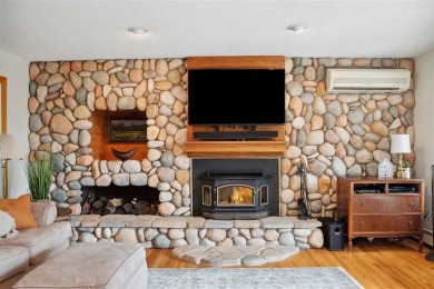 Cozy up to the crackle of the real wood fireplace in this home on Lake McBride Golf Course in Iowa - for sale on GolfHomes.com, golf home, golf lot