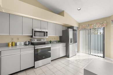 Great buy! Just reduced! Spacious, bright corner-unit townhome on Woodmont Country Club in Florida - for sale on GolfHomes.com, golf home, golf lot