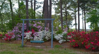 Farmhouse charmer on the scenic 9th fairway at Gates Four! on Gates Four Golf and Country Club in North Carolina - for sale on GolfHomes.com, golf home, golf lot