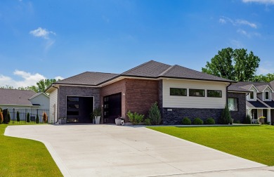 Discover this exquisite home nestled beside the Arnold Palmer on Tournament Club of Iowa in Iowa - for sale on GolfHomes.com, golf home, golf lot