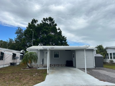 THIS TWO BEDROOM TWO BATH HOME SITS ON THE GOLF COURSE WITH A on Silver Dollar Golf and Trap Club in Florida - for sale on GolfHomes.com, golf home, golf lot