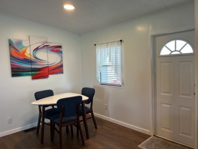THIS TWO BEDROOM TWO BATH HOME SITS ON THE GOLF COURSE WITH A on Silver Dollar Golf and Trap Club in Florida - for sale on GolfHomes.com, golf home, golf lot