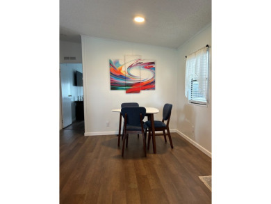 THIS TWO BEDROOM TWO BATH HOME SITS ON THE GOLF COURSE WITH A on Silver Dollar Golf and Trap Club in Florida - for sale on GolfHomes.com, golf home, golf lot