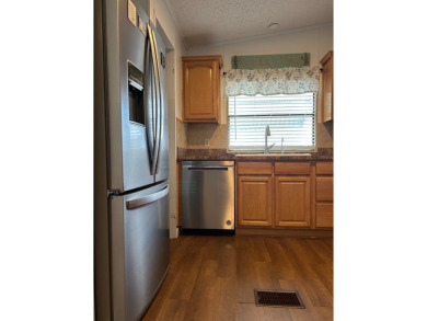 THIS TWO BEDROOM TWO BATH HOME SITS ON THE GOLF COURSE WITH A on Silver Dollar Golf and Trap Club in Florida - for sale on GolfHomes.com, golf home, golf lot