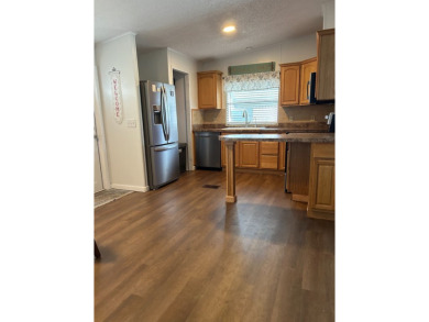 THIS TWO BEDROOM TWO BATH HOME SITS ON THE GOLF COURSE WITH A on Silver Dollar Golf and Trap Club in Florida - for sale on GolfHomes.com, golf home, golf lot