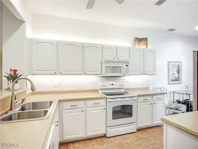 *Honey, we're home!* You're going to love this stunning attached on Herons Glen Golf and Country Club in Florida - for sale on GolfHomes.com, golf home, golf lot