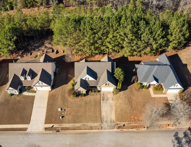 Beautifully maintained and move-in ready, this home is located on Canongate At Healy Point Country Club in Georgia - for sale on GolfHomes.com, golf home, golf lot