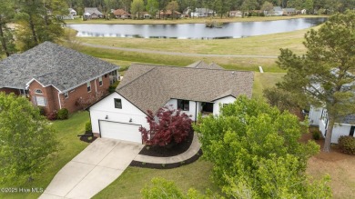 Nestled in a serene, nature-filled environment, this beautifully on Harbour Point Golf Club in North Carolina - for sale on GolfHomes.com, golf home, golf lot