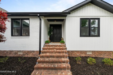 Nestled in a serene, nature-filled environment, this beautifully on Harbour Point Golf Club in North Carolina - for sale on GolfHomes.com, golf home, golf lot
