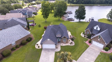 Immaculate LAKE ARBU WATERFRONT HOME on a cul-de-sac in gated on Players Course At Wyboo Plantation in South Carolina - for sale on GolfHomes.com, golf home, golf lot
