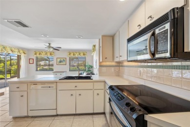 SELLER PRICED TO SELL! CANALFRONT POOL HOME LOCATED IN THE on Rotonda Golf and Country Club The Palms Course in Florida - for sale on GolfHomes.com, golf home, golf lot