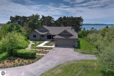 Shared waterfront and multiple views of Crystal Lake from this on Crystal Lake Golf Club in Michigan - for sale on GolfHomes.com, golf home, golf lot