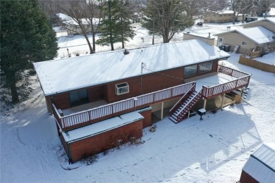 Cozy up to the crackle of the real wood fireplace in this home on Lake McBride Golf Course in Iowa - for sale on GolfHomes.com, golf home, golf lot