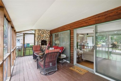 Cozy up to the crackle of the real wood fireplace in this home on Lake McBride Golf Course in Iowa - for sale on GolfHomes.com, golf home, golf lot